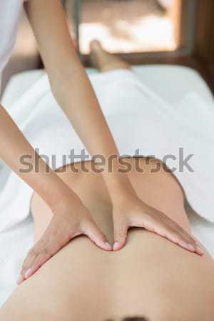 Stock photo: Sitting woman touching her painful knee 