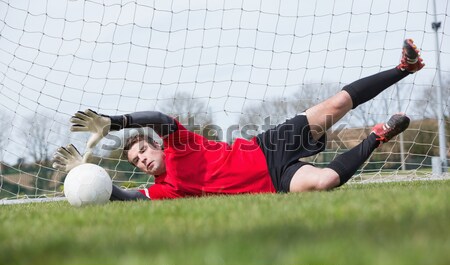 Stock photo: A rugby player scoring a try