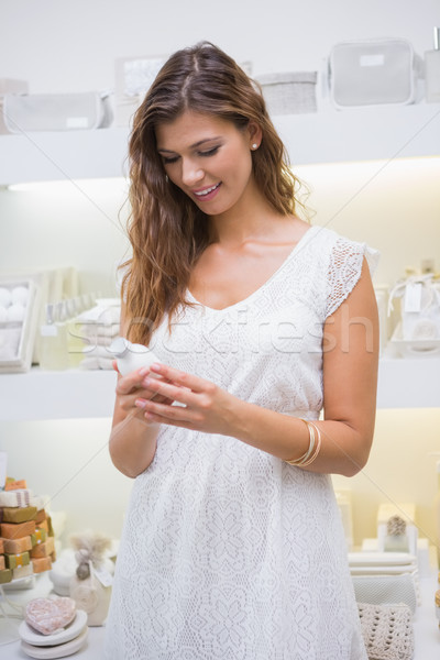 Stock photo: Smiling woman reading ingredients 