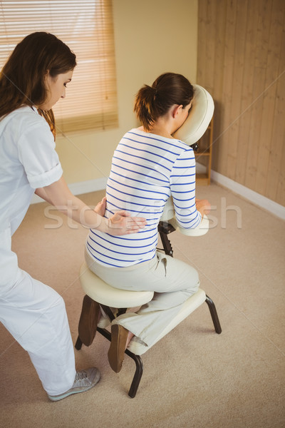 Jeune femme massage président thérapie chambre femme [[stock_photo]] © wavebreak_media