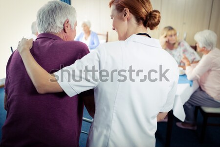 Hátsó nézet mosolyog női orvos testmozgás idős Stock fotó © wavebreak_media