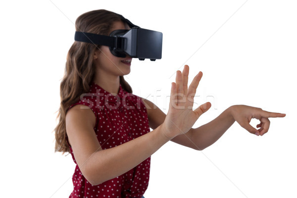 Teenage girl using virtual reality headset Stock photo © wavebreak_media