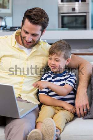 Father and daughter reading book on bed Stock photo © wavebreak_media