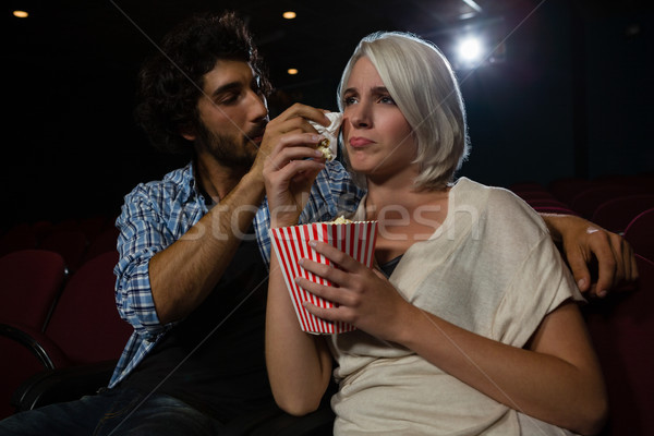 Couple getting emotional while watching movie in theatre Stock photo © wavebreak_media