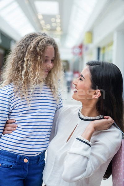 Stock photo: Happy mother and daughter in shopping mall