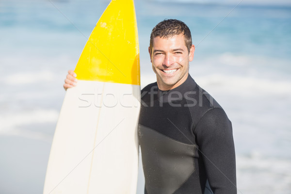 Retrato feliz homem prancha de surfe praia Foto stock © wavebreak_media