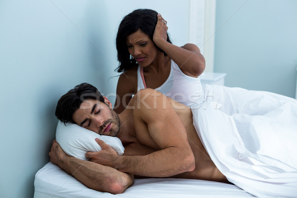 Woman ignoring while man snoring on bed Stock photo © wavebreak_media