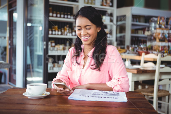 Stock photo: Beautiful woman using mobile phone