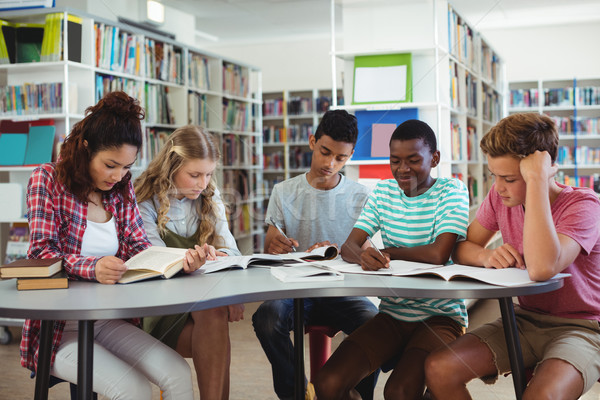 Attentive classmates studying in library Stock photo © wavebreak_media