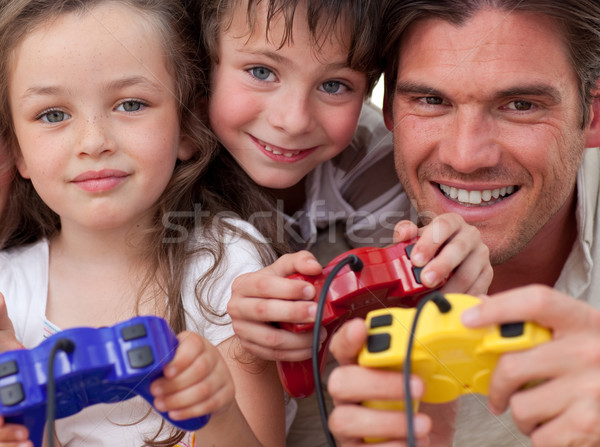 Happy father and his children playing video games Stock photo © wavebreak_media