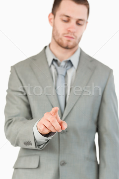 Young businessman using futuristic touchscreen against a white background Stock photo © wavebreak_media