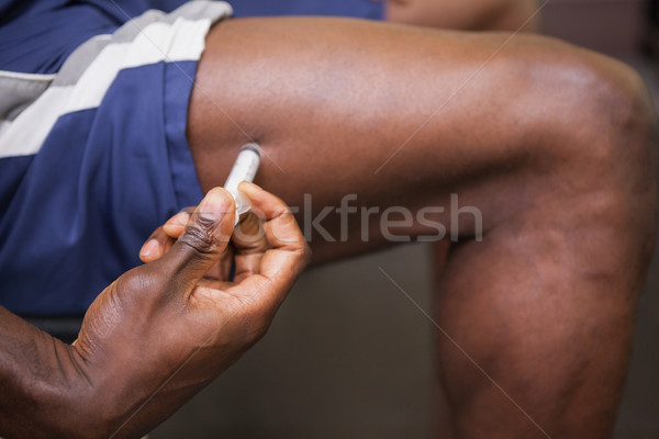 Muscular man injecting steroids Stock photo © wavebreak_media