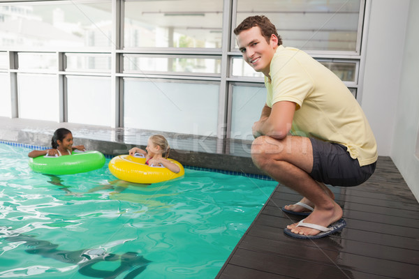 Swimming coach smiling at camera by the pool Stock photo © wavebreak_media