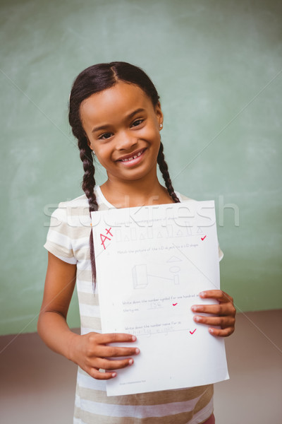 Stock photo: Portrait of cute little girl holding paper