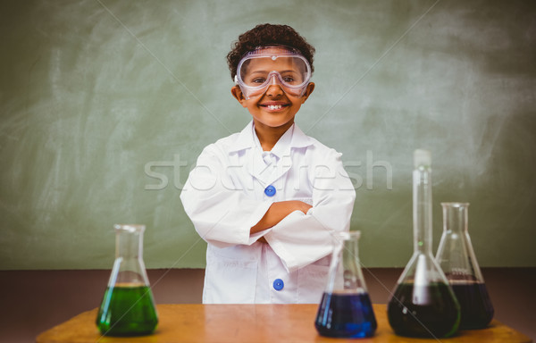 Cute boy with conical flasks in classroom Stock photo © wavebreak_media