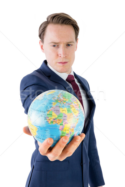 Serious businessman holding terrestrial globe  Stock photo © wavebreak_media