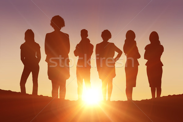 Composite image of standing silhouettes Stock photo © wavebreak_media