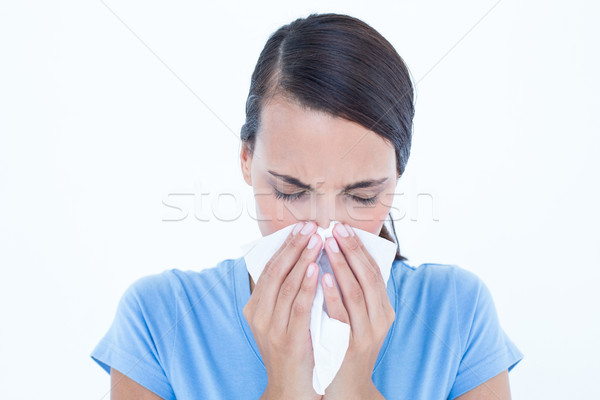Chorych kobieta dmuchanie nosa biały niebieski kobiet Zdjęcia stock © wavebreak_media