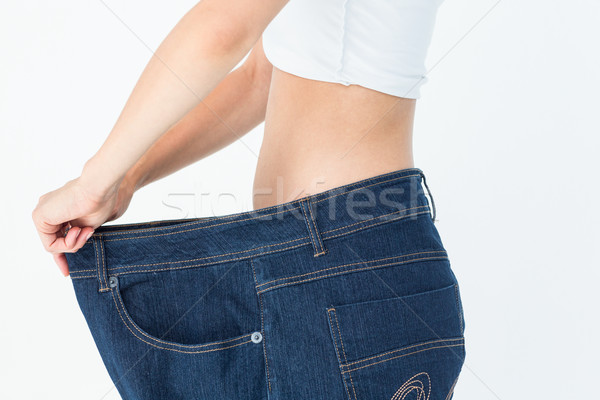 Woman belly in too big pants Stock photo © wavebreak_media