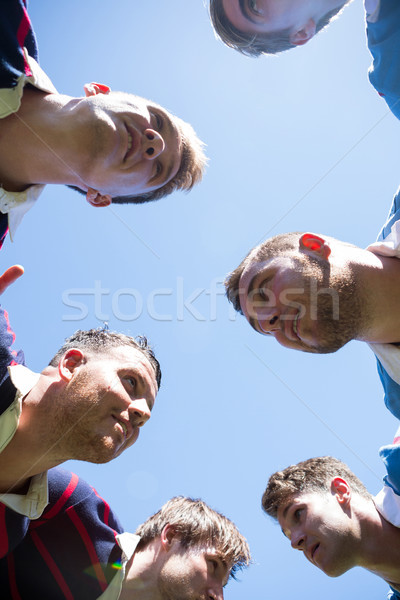 Low angle view of rugby players making huddle Stock photo © wavebreak_media