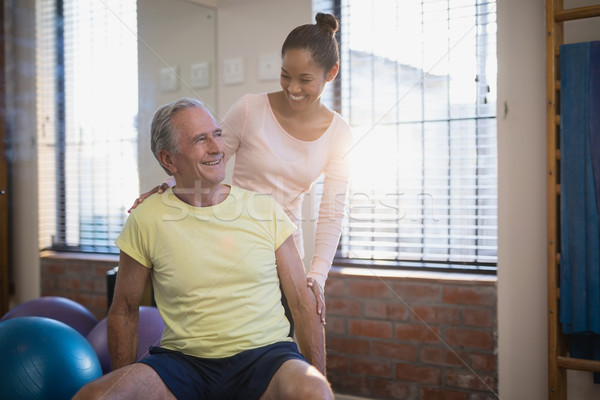 Souriant Homme thérapeute regarder supérieurs Homme [[stock_photo]] © wavebreak_media