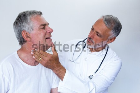 Doctor consoling senior man in nursing home Stock photo © wavebreak_media