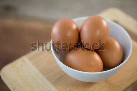 Marrón huevos tazón tabla de cortar mesa madera Foto stock © wavebreak_media