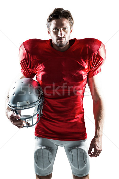 American football player in red jersey holding helmet Stock photo © wavebreak_media