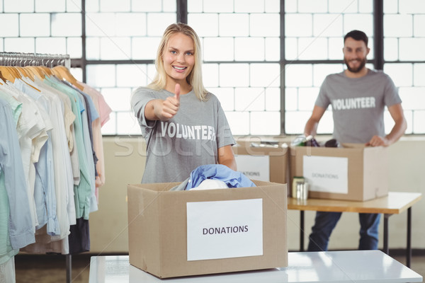 Portrait of smiling volunteer gesturing thumbs in office  Stock photo © wavebreak_media