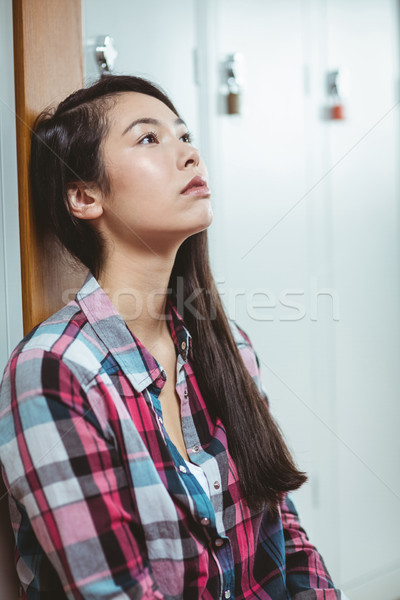 Troubled student sitting and looking up Stock photo © wavebreak_media