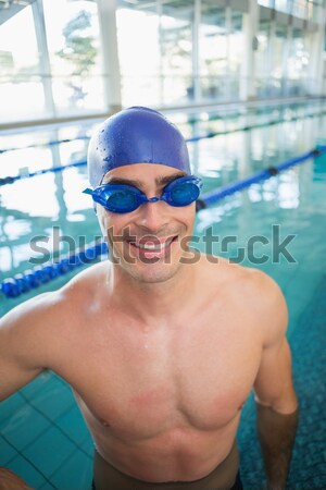 Handsome man wearing swim cap and goggles Stock photo © wavebreak_media