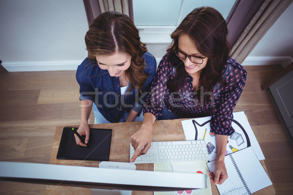 Two beautiful women using computer Stock photo © wavebreak_media