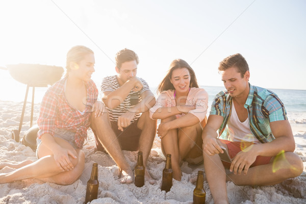 Stock photo: Smiling friends sitting