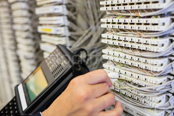 Technician using digital cable analyzer Stock photo © wavebreak_media