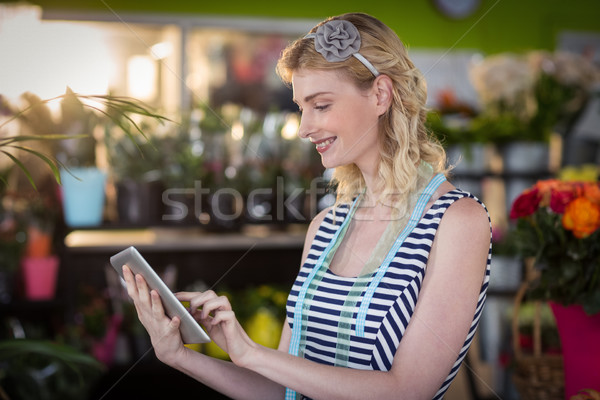 Femminile fiorista digitale tablet business Foto d'archivio © wavebreak_media
