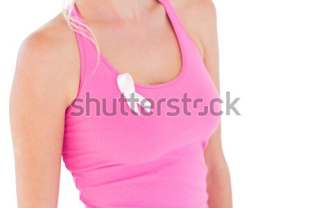 Woman putting up fists for breast cancer awareness with pink ribbon on white background Stock photo © wavebreak_media