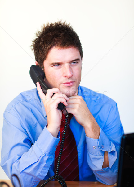 Serious businessman talking on the phone  Stock photo © wavebreak_media