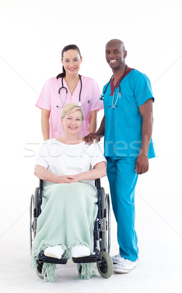 Doctors with a patient in a wheel chair Stock photo © wavebreak_media