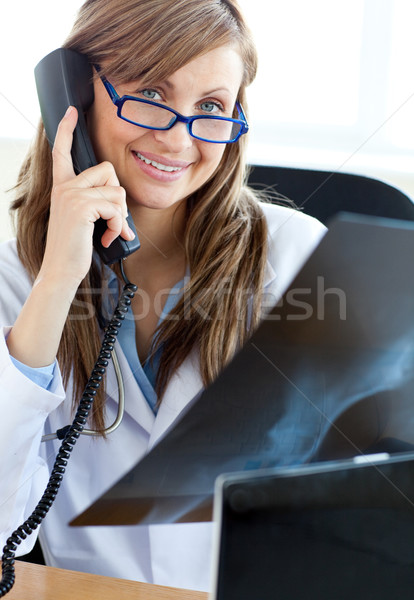 Happy female doctor talking on the phone Stock photo © wavebreak_media