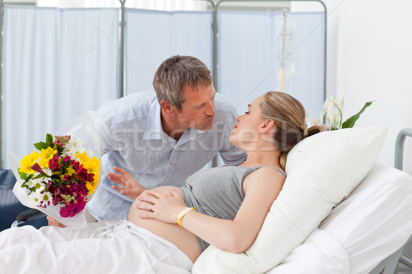 Man kissing his pregnant wife Stock photo © wavebreak_media