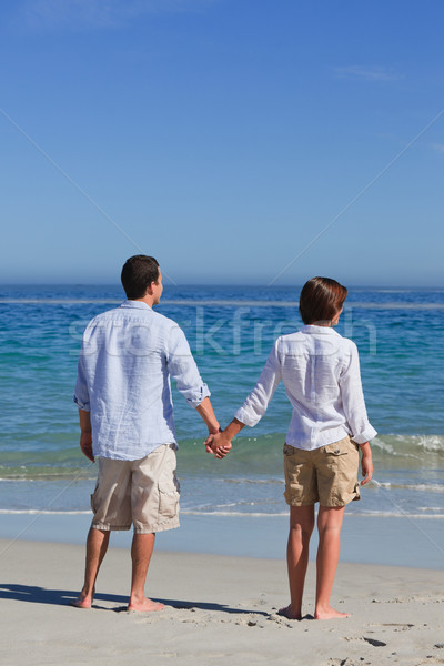 Enamored couple looking at the sea Stock photo © wavebreak_media
