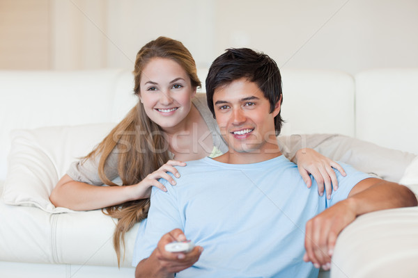 Happy couple watching television in their living room Stock photo © wavebreak_media