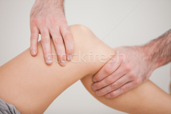 Knee of a patient being touched by a practitioner in a room Stock photo © wavebreak_media