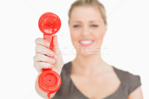 Retro red phone n a hand of woman against white background Stock photo © wavebreak_media