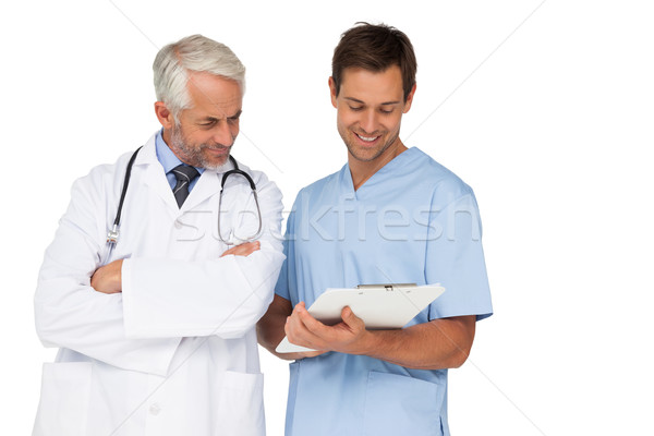 Médico do sexo masculino cirurgião discutir relatórios branco homem Foto stock © wavebreak_media