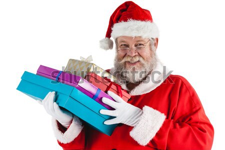 Santa spread presents with shopping cart Stock photo © wavebreak_media