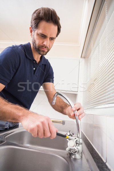 Plumber fixing the sink with wrench Stock photo © wavebreak_media