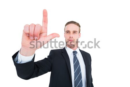 Unsmiling businessman in suit pointing up his finger Stock photo © wavebreak_media