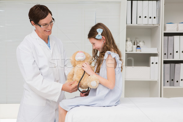 Doctor examining little girl Stock photo © wavebreak_media