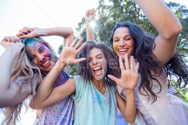 Stock photo: Happy friends covered in powder paint